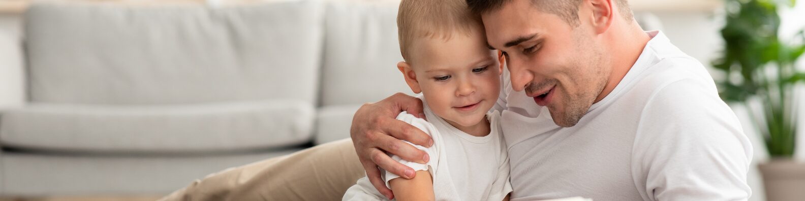 Father holding child discussing legal paternity rights in Idaho